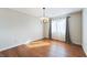 Bright dining room with hardwood floors and a stylish light fixture at 3705 River Rd, Columbus, IN 47203