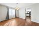 Dining area with hardwood floors, access to the kitchen, and great natural light at 3705 River Rd, Columbus, IN 47203