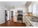 Stainless steel appliances and granite countertops accent the cabinetry in this kitchen at 3705 River Rd, Columbus, IN 47203