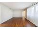 Living room with hardwood floors, ample natural light, and neutral walls at 3705 River Rd, Columbus, IN 47203
