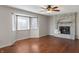 Bright living room with a decorative brick fireplace and a large bay window at 3705 River Rd, Columbus, IN 47203