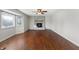 Spacious living room features a decorative brick fireplace and a large bay window at 3705 River Rd, Columbus, IN 47203
