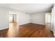 Open living area with hardwood floors, neutral walls, and access to multiple rooms at 3705 River Rd, Columbus, IN 47203