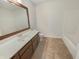 Practical bathroom with a single sink vanity, a bathtub, and neutral flooring at 3936 Par Dr, Indianapolis, IN 46268