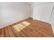 Bedroom with wood-look flooring, white walls, and closet for ample storage space at 3936 Par Dr, Indianapolis, IN 46268