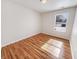 Bright bedroom features wood-look floors, natural light from window, and neutral wall color at 3936 Par Dr, Indianapolis, IN 46268