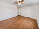 Bright bedroom features clean white walls, a ceiling fan, new flooring and two closets at 3936 Par Dr, Indianapolis, IN 46268