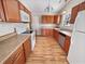 Functional kitchen with wood cabinets, stainless steel appliances, and ample counter space at 3936 Par Dr, Indianapolis, IN 46268