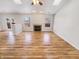 Bright open living area with fireplace, new floors, and sliding glass doors to the backyard deck at 3936 Par Dr, Indianapolis, IN 46268