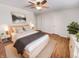 Comfortable main bedroom with soft lighting, a ceiling fan, and neutral decor at 3936 Par Dr, Indianapolis, IN 46268