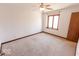 Bedroom featuring neutral carpet, natural light from the window, and ceiling fan at 3948 S Woodfield Dr, New Palestine, IN 46163