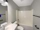 Bathroom features tub and shower combination with black hardware, and a vanity with storage at 3951 Narrowleaf Ct, Indianapolis, IN 46235