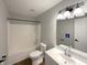 Updated bathroom with shower and bath, modern fixtures, and a vanity with storage at 3951 Narrowleaf Ct, Indianapolis, IN 46235