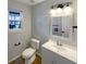 Bathroom features modern fixtures, vanity with storage, and a framed mirror at 3951 Narrowleaf Ct, Indianapolis, IN 46235