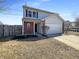 Charming two-story home with a two-car garage and a long driveway and manicured lawn at 3951 Narrowleaf Ct, Indianapolis, IN 46235