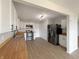 Updated kitchen featuring stainless steel appliances, butcher block countertops, and wood-look flooring at 3951 Narrowleaf Ct, Indianapolis, IN 46235