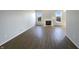 Inviting living room featuring a modern fireplace and beautiful hardwood flooring at 3951 Narrowleaf Ct, Indianapolis, IN 46235