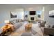 Bright living room with a fireplace, large windows, and stylish furniture and decor at 3951 Narrowleaf Ct, Indianapolis, IN 46235
