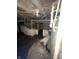 Unfinished basement with exposed beams and outdated utilities, presenting renovation possibilities at 408 E Monroe St, Alexandria, IN 46001