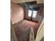 Compact bedroom with aged pink walls and window, highlighting repair opportunities at 408 E Monroe St, Alexandria, IN 46001