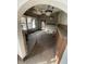 Interior view of a room with an arched doorway and vintage light fixtures, showing deferred maintenance at 408 E Monroe St, Alexandria, IN 46001