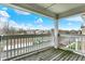 Balcony view with railing overlooking a parking lot and surrounding buildings at 4925 Opal Ridge Ln # 309, Indianapolis, IN 46237