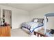 Cozy bedroom features a comfortable bed and access to the hallway at 4925 Opal Ridge Ln # 309, Indianapolis, IN 46237