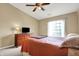 Bedroom with vaulted ceiling, natural light, and a spacious layout with a dark wood dresser at 4925 Opal Ridge Ln # 309, Indianapolis, IN 46237