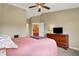 Bedroom featuring a comfortable bed, ceiling fan, and natural light from a window at 4925 Opal Ridge Ln # 309, Indianapolis, IN 46237