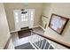 Apartment entryway with white door, stairs, tile floor, carpet and bulletin board at 4925 Opal Ridge Ln # 309, Indianapolis, IN 46237