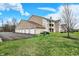 Apartment building with brick and siding, garages, and a well-maintained lawn at 4925 Opal Ridge Ln # 309, Indianapolis, IN 46237
