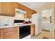 Functional kitchen with appliances and adjacent laundry area for added convenience at 4925 Opal Ridge Ln # 309, Indianapolis, IN 46237