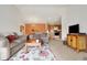 Open-concept living space with sofa, dining area, kitchen, and decorative furnishings at 4925 Opal Ridge Ln # 309, Indianapolis, IN 46237