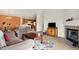 Inviting living room with a fireplace, adjacent dining area, and access to the kitchen at 4925 Opal Ridge Ln # 309, Indianapolis, IN 46237