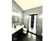 Modern bathroom with sleek black vanity and stand-up shower at 511 N Clark St, Lebanon, IN 46052