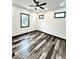 Well-lit bedroom featuring updated flooring, fresh paint, and modern ceiling fan at 511 N Clark St, Lebanon, IN 46052