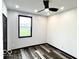 Bedroom featuring modern ceiling fan, window and sleek black trim at 511 N Clark St, Lebanon, IN 46052