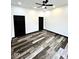 Bedroom featuring a modern ceiling fan, fresh paint, and stylish flooring at 511 N Clark St, Lebanon, IN 46052