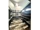 Walk-in closet featuring custom shelving, track lighting and stylish wood-look flooring at 511 N Clark St, Lebanon, IN 46052