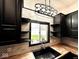 A kitchen sink sits below a window providing natural light, complemented by modern backsplash and cabinets at 511 N Clark St, Lebanon, IN 46052