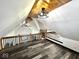 Spacious loft with sloped ceilings, modern fans and railing at 511 N Clark St, Lebanon, IN 46052