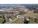 Aerial view showing the expansive property with surrounding construction, land, and neighborhood at 5529 W Mccord Rd, McCordsville, IN 46055