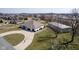 Beautiful aerial view featuring a home with 3 car garage, large outbuilding, and mature trees at 5529 W Mccord Rd, McCordsville, IN 46055