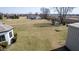 Spacious backyard with a playground and a detached garage in the background at 5529 W Mccord Rd, McCordsville, IN 46055