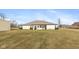Expansive backyard showing the rear of the house with neat landscaping, and a storage shed at 5529 W Mccord Rd, McCordsville, IN 46055
