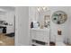 Charming bathroom vanity with decorative mirror, stylish fixtures, and ample storage for an organized space at 5529 W Mccord Rd, McCordsville, IN 46055