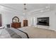 Spacious bedroom featuring tray ceilings and ample space, offers a luxurious and comfortable living area at 5529 W Mccord Rd, McCordsville, IN 46055