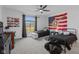Well-lit bedroom featuring two twin beds, baseball themed decorations, and large window at 5529 W Mccord Rd, McCordsville, IN 46055