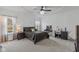 Bright and airy bedroom with a queen-sized bed, a vanity, and neutral décor at 5529 W Mccord Rd, McCordsville, IN 46055