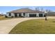 Stunning ranch-style home with a well-manicured lawn and an attached three car garage at 5529 W Mccord Rd, McCordsville, IN 46055